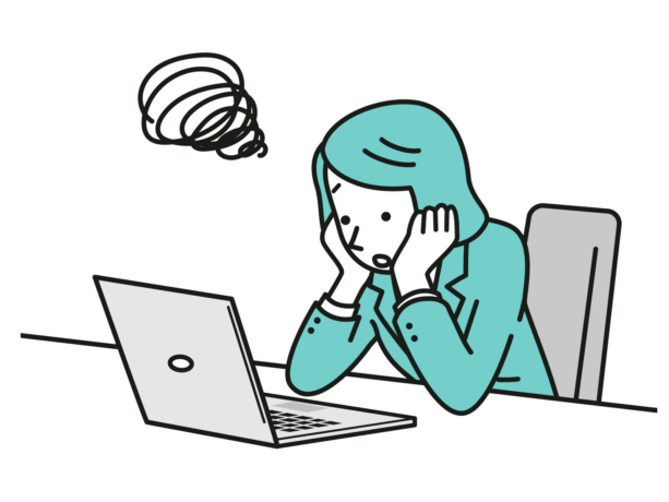 PCを見て悩んでいる女性